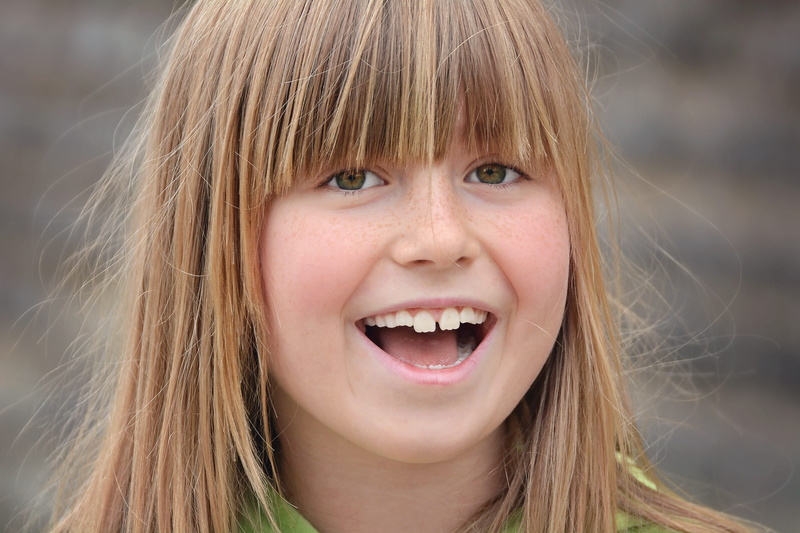 headshot, close, view, looking at camera, human face, human, mouth open, happiness, emotion, laugh, one person, hair, 1080P, bangs, gap toothed, female