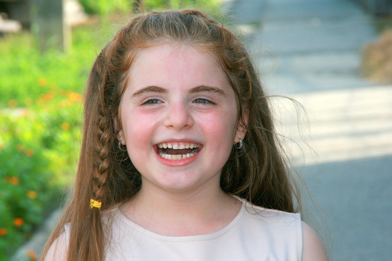 looking at camera, girl, teeth, headshot, happiness, laugh, hair, cheerful, mouth open, one person, women, girls, innocence, offspring, human body part