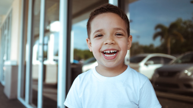 teeth, face, one person, vehicle, lifestyles, kid smiling, smile, males, smiling, wearing, toothy smile, kids, boy smiling, human, neck, brucie, laughing