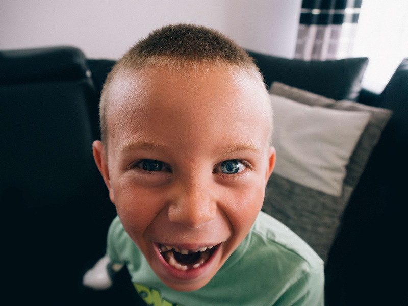 night, looking at camera, front view, one person, home interior, innocence, portrait, headshot, emotion, gap toothed, 4K, boys, indoors, childhood, mouth open