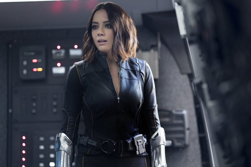 front view, looking at camera, young adult, leather, long hair, standing, one person, indoors, 2K, women, focus on foreground, waist up, adult, hair, agent of shield