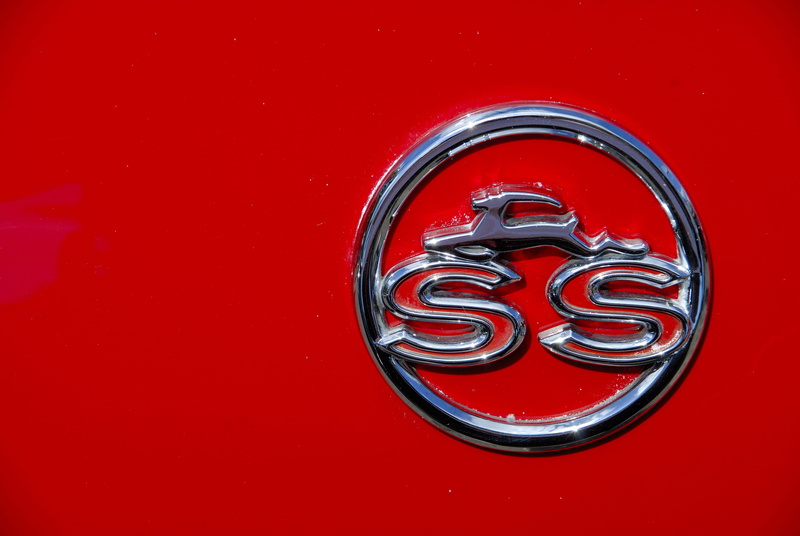emblem, no people, food and drink, shape, ss, red background, studio shot, number, silver colored, red, chrome, vehicle, colored background, car, sweet food