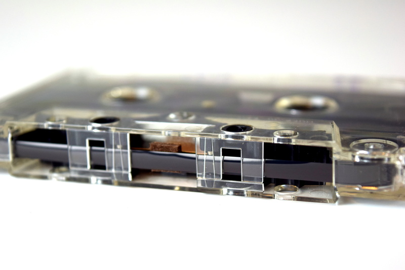 closeup, 5K, film reel, metal, single object, studio shot, selective focus, musical instrument, analog, magnetic tape, technology, music, retro styled