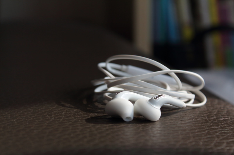 surface level, flooring, headphone, large group of objects, table, earphone, personal accessory, variation, wood - material, representation, choice, connection