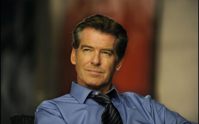 males, gray hair, headshot, portrait, looking at camera, confidence, shirt and tie, actor, contemplation, focus on foreground, one person, button down shirt
