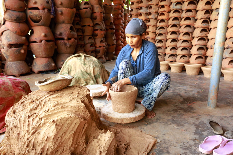 outdoors, arts and crafts, craft, artisan, artist, men, rural scene, woman, container, women, art, production, skill, one person, slippers, art and craft