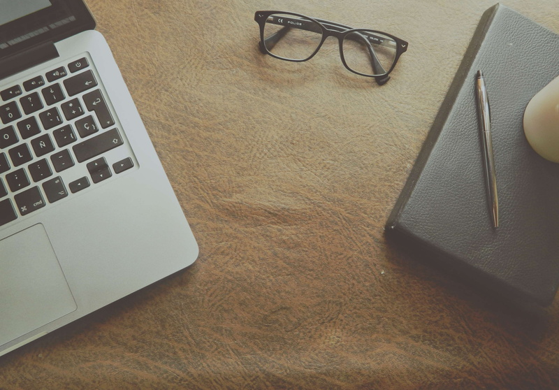 education, eyewear, notebook, macbook, eyeglasses, wireless technology, computer keyboard, laptop, still life, business, communication, indoors, ballpen