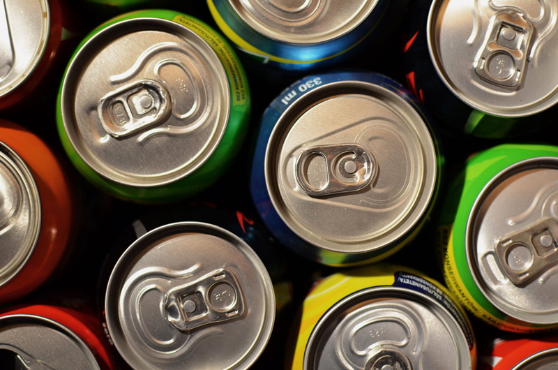 metal, drinks, large group of objects, circle, silver colored, refreshment, directly above, no people, beverage, can, aluminum, drink, cans, still life