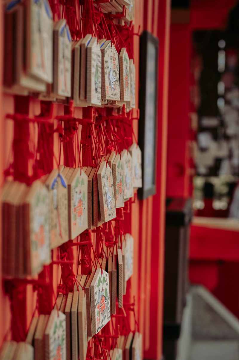 symbol, incense, focus on foreground, accessories, logo, publication, wall, in a row, spice, large group of objects, place of worship, red, belief, monk