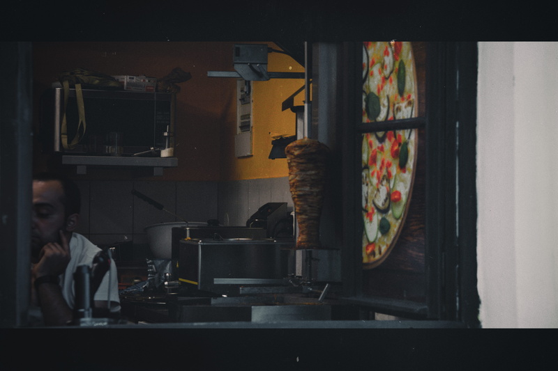 domestic room, meat, standing, stove, real people, female, room, housing, commercial kitchen, beside, oven, face, preparation, cafe, portrait, person, photo booth