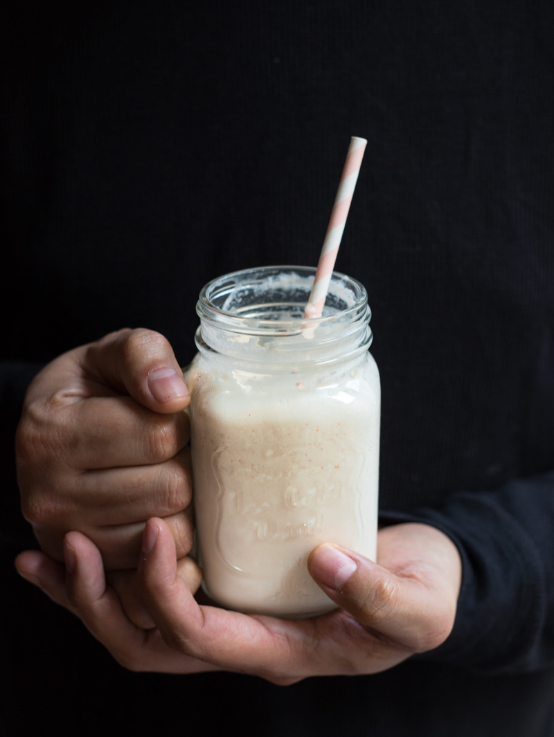 hand, glass, filled, clear, healthy, drink, refreshment, graviola, drinking glass, human hand, food photography, black background, mason jar, drinking straw