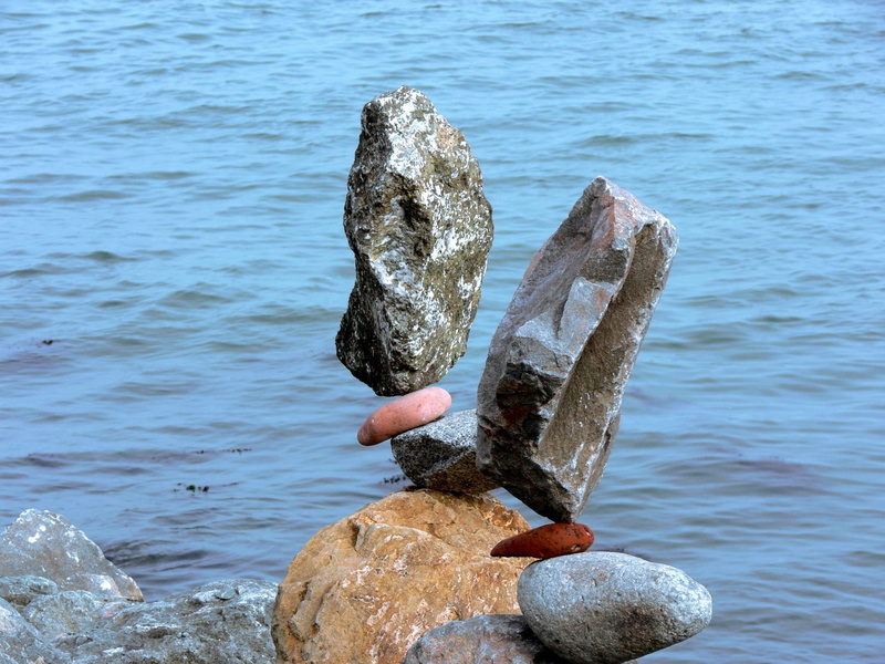 magic, bird, holding, pile, rock - object, finger, hand, solid, human body part, one person, one animal, outdoors, animals in the wild, Balanced, human finger