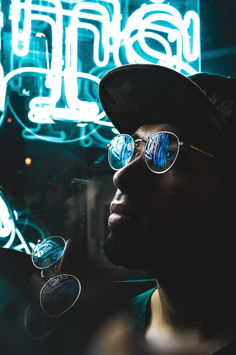 light, one person, spectacle, men, glasses, wearing, outdoors, leisure activity, cap, baseball cap, silver, man, text, guy, sign, real people, black, fashion