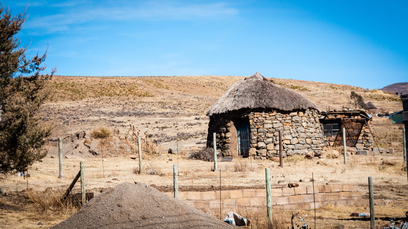 sky, blue, lesotho, ancient civilization, arid climate, land, thatched roof, landscape, day, africa, no people, scenics - nature, building exterior, clear sky