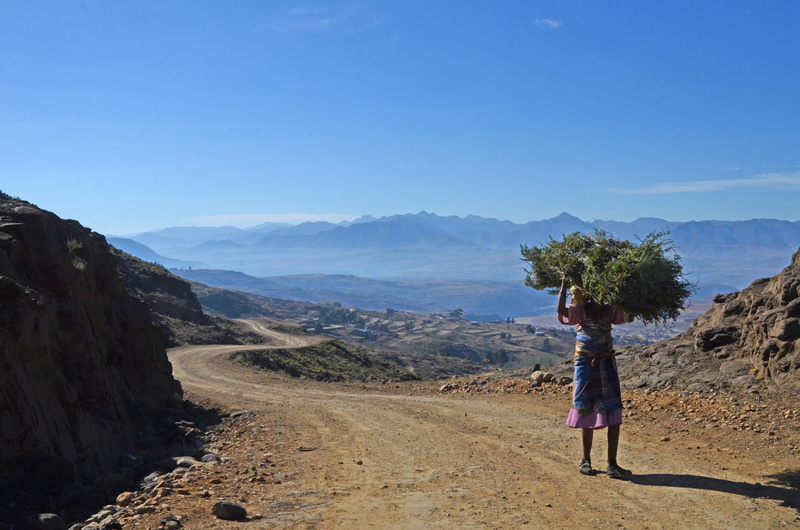 sky, mountains, real people, country, non-urban scene, rear view, one person, women, environment, scenics - nature, burden, walking, leisure activity, scenic