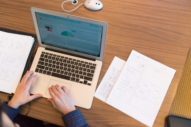 air, wooden table, data, human hand, computer, communication, from above, macbook, person, working, human body part, desk, laptop, writing, connection