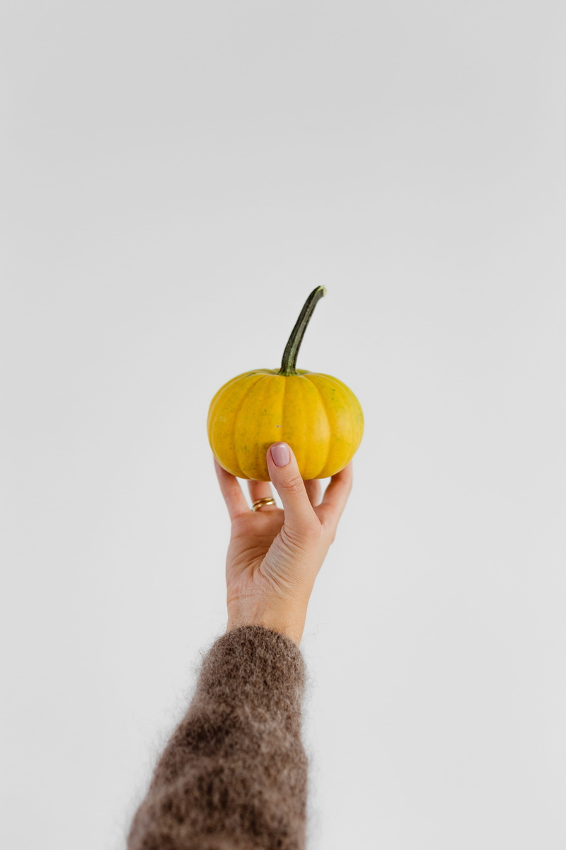 female, finger, ripe, wellbeing, human limb, studio shot, vegetable, autumn, food, freshness, white background, copy space, orange, 5K, healthy lifestyle