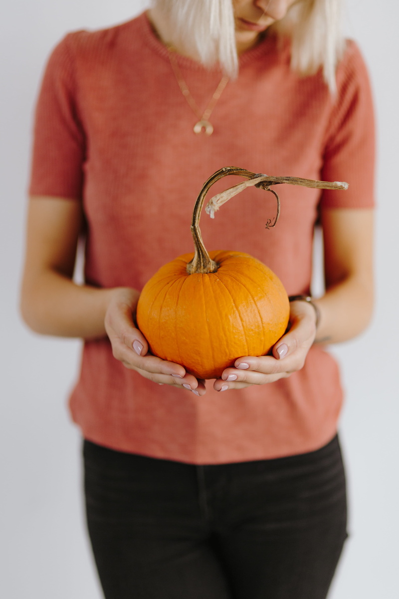 orange, autumn, 4K, one person, front view, s, standing, midsection, studio shot, vegetable, sweater, celebration, food and drink, pumpkin, blond hair