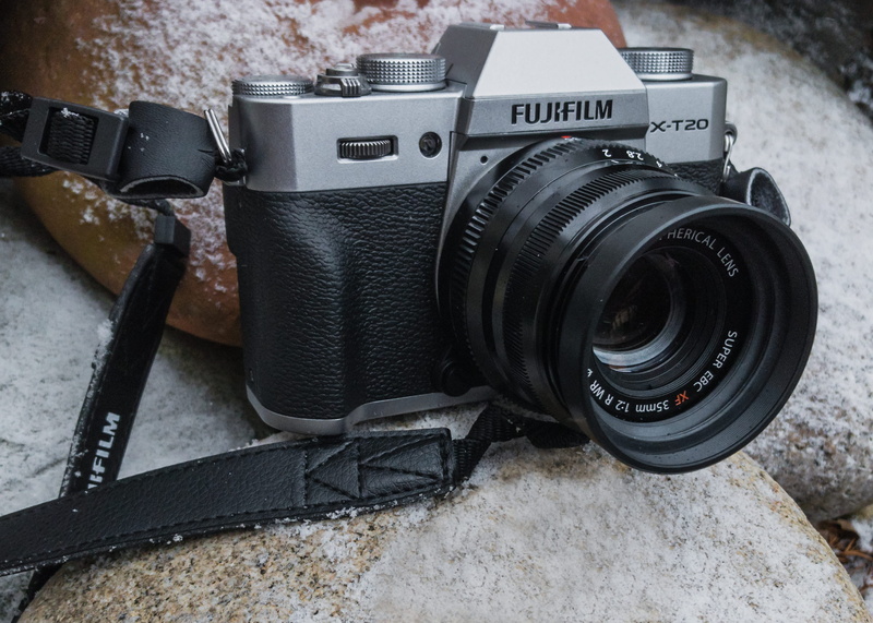 photographic equipment, retro styled, single object, photography themes, fujifilm x-t20, modern, slr camera, camera strap, black color, camera lens, equipment