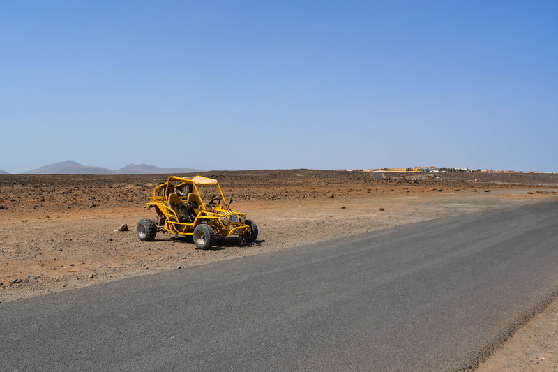 sky, clear sky, land, outdoors, way, blue, copy space, arid climate, quad, sunlight, mode of transportation, transportation, no people, machinery, nature