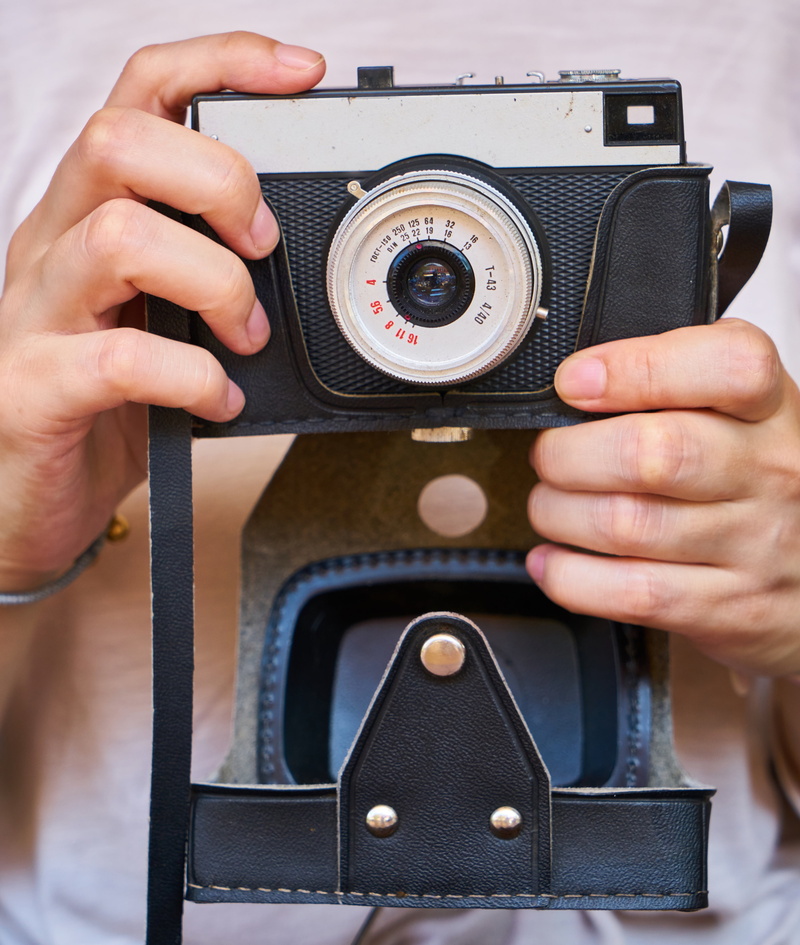 macro, toys hobbies, real people, product photo, slr camera, hands, midsection, leisure activity, close-up, design, womens, camera, digital camera, one person