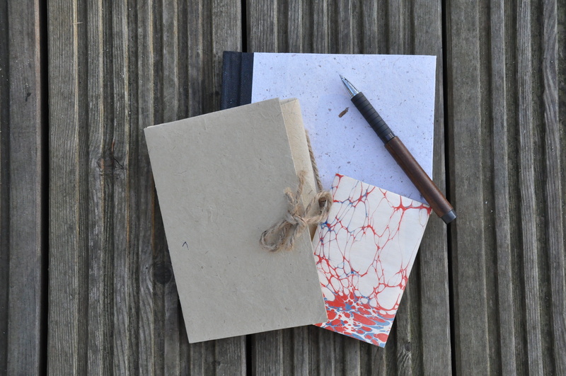 no people, indoors, document, leave, still life, notebook, blank, table, wood - material, close-up, stationery, high angle view, writing instrument, white color