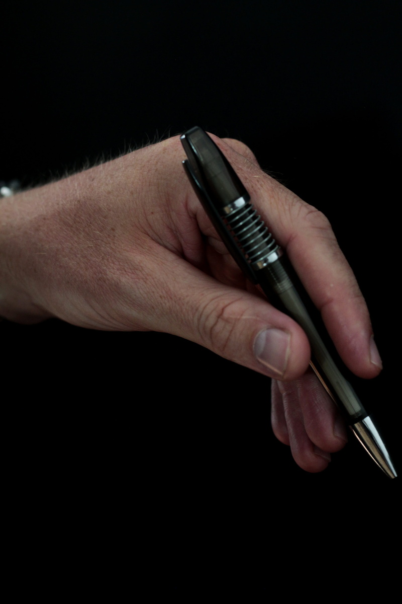 studio shot, real people, finger, silver colored, post, adult, stationery, business, indoors, leave, Coolie, holding, desk, lifestyles, human body part
