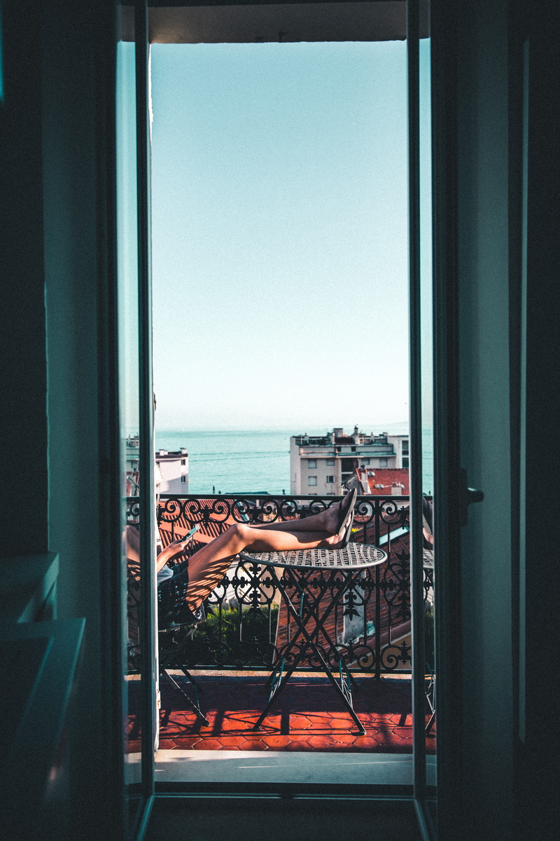 transportation, table, Windowsill, patio, female, day, sitting, transparent, window, 5K, architecture, horizon, sky, sea, doorway, glass - material, clear sky