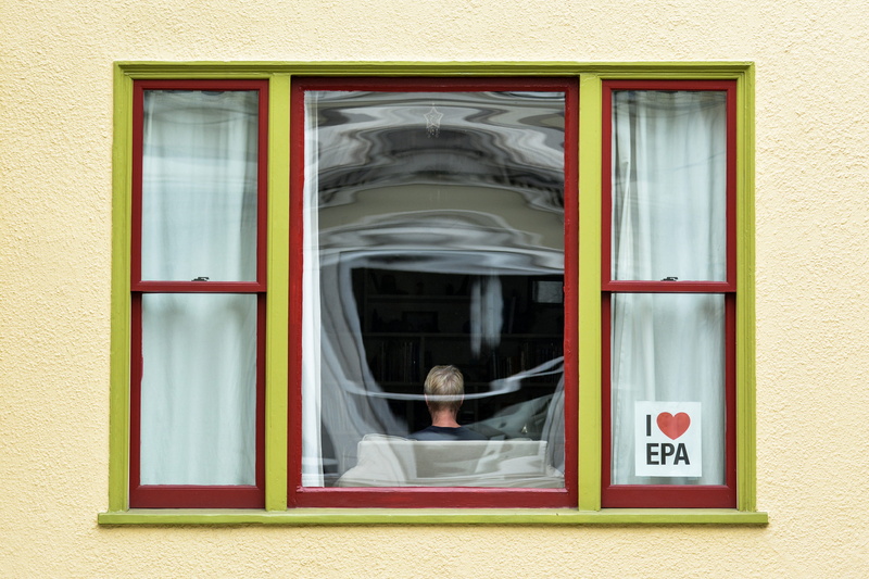 business, people, building exterior, city, yellow, built structure, curtain, chair, red, architecture, transparent, window frame, blurred motion, wall