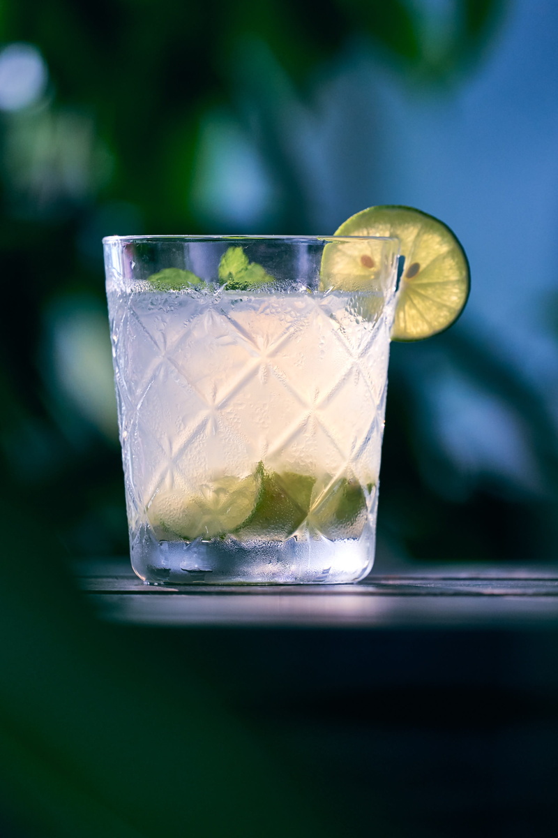 focus on foreground, food and drink, drink, freshness, household equipment, table, lime, liquid, alcohol, cold - temperature, non-alcoholic beverage, glass
