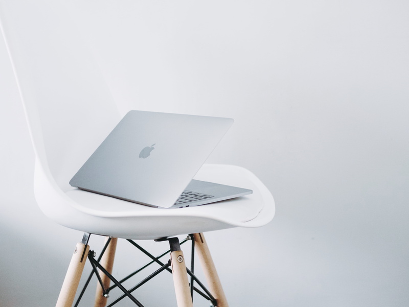 copy space, no people, table, global communications, white color, white background, chair, studio shot, silver, desk, connection, still life, macbook, stool
