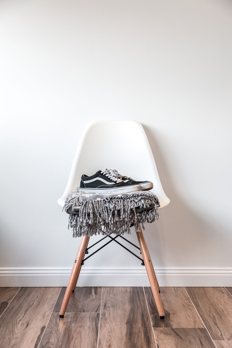 skool, shoes, hardwood floor, wall - building feature, wall, beside, old, stool, eames, home improvement, day, home, skate, copy space, still life, domestic room