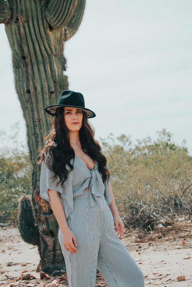 long hair, beautiful, one person, top, desert, clothing, hair, black, field, lady, leisure activity, fashion, young adult, front view, three quarter length
