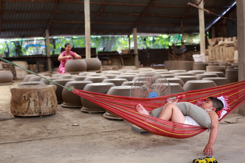 men, pot, red, adult, recreation, wear, resting, artist, arts and crafts, women, sleeping, artistic, outdoors, boy, full length, lying, child, sit, people