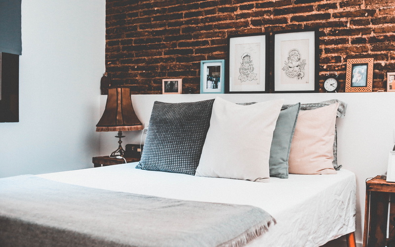 wall, home, brick wall, table lamp, luxury, bedroom, built structure, domestic room, room, water, building, wealth, lighting equipment, interior design