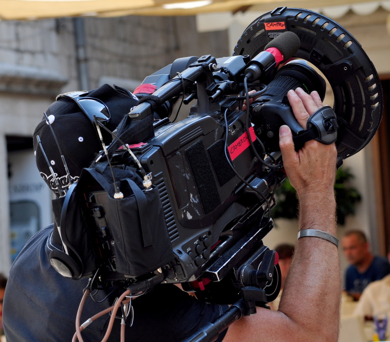 camera - photographic equipment, black color, video, close-up, photo shoot, tv, cinematographer, technology, one person, tv camera, focus on foreground