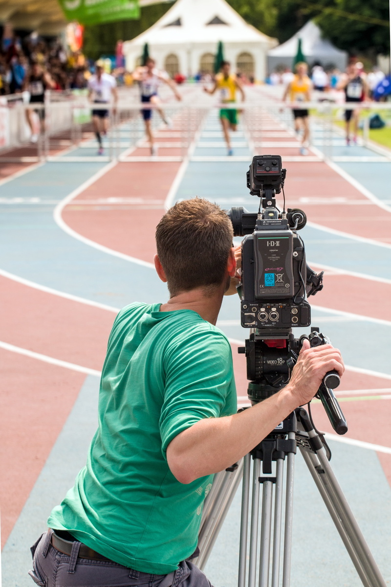 technology, rear view, film, outdoors, 5K, camcorder, lifestyles, focus on foreground, track and field, real people, sport, man, daytime, cinematographer