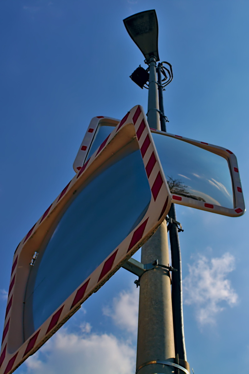 antenna, logo, metal, banister, leisure activities, mirror, adventure, electrical device, communication, symbol, lamp post, tarmac, asphalt, trademark