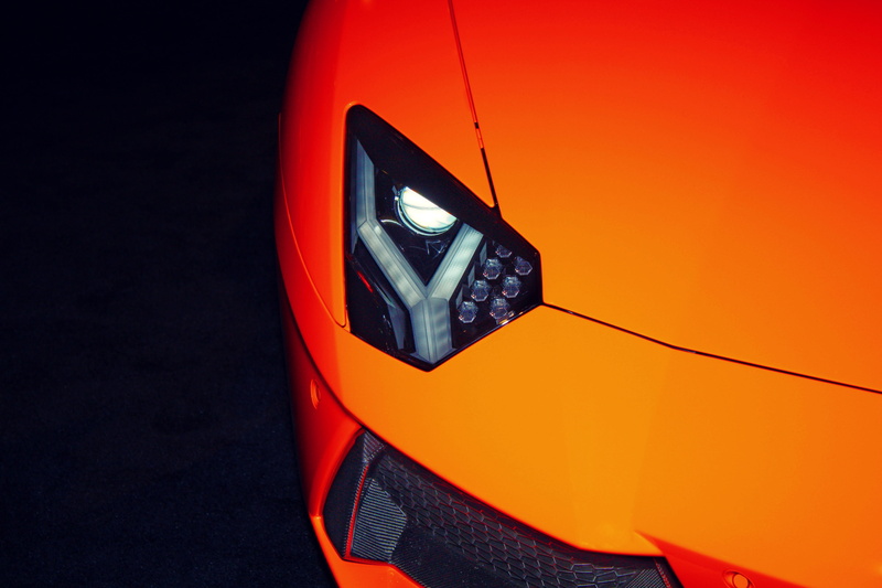 telephone, orange color, headlight, technology, mode of transportation, road, connection, motor vehicle, close-up, exotic car, lamps, transportation, lamborghini