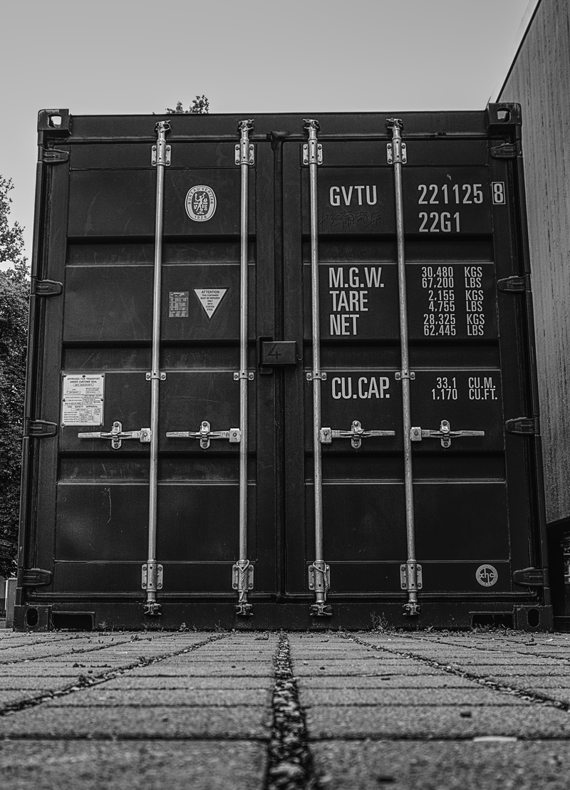 container, information, sign, architecture, no people, footpath, script, building exterior, cargo, wall - building feature, store, nature, day, sky, communication