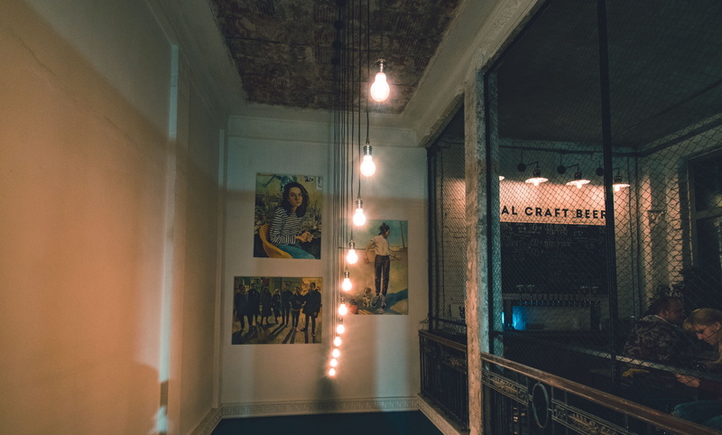 no people, night, store, lights, illuminated, art and craft, ceiling, 5K, lighting equipment, western script, human representation, architecture, text