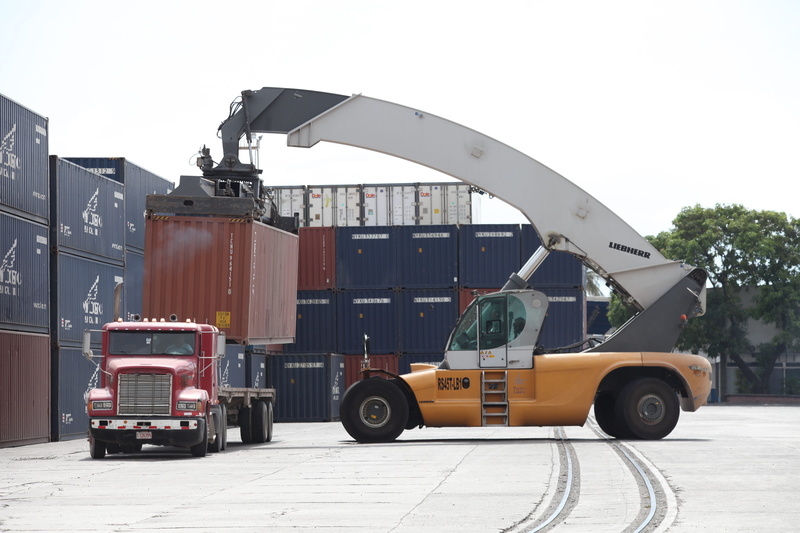 near, built structure, sky, architecture, yellow, road, stationary, nature, truck crane, outdoors, truck, red, port, machinery, business, trailer, freight transportation