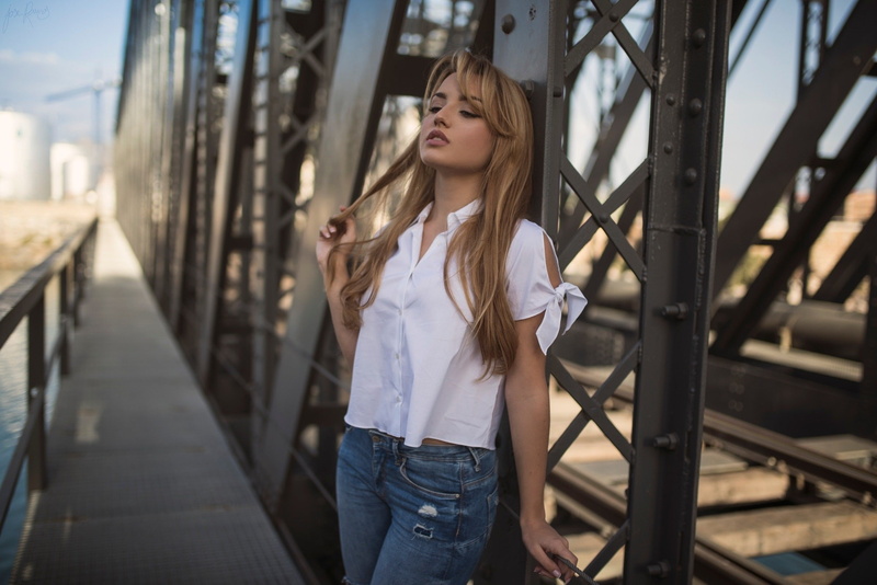 blonde, 1080P, holding hair, depth of field, women, white shirt, pants, portrait, jeans, shirt, Carolina Camacho