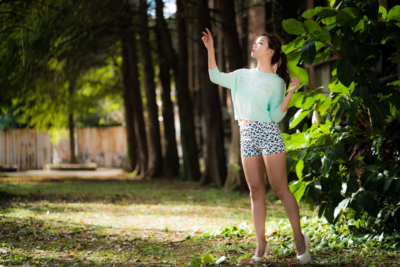 plant, beauty, real people, painted nails, shorts, outdoors, hairstyle, tree, Asian, necklace, ponytail, nature, leisure activity, young women, arms raised