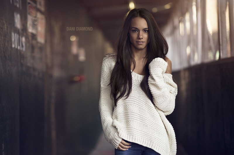 white sweater, Dani Diamond, jeans, 720P, brunette, hallway, sweater, long hair, brown eyes, women, touching hair, model