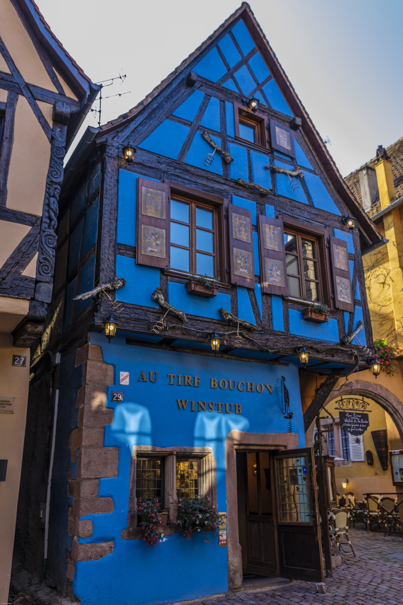 sky, picturesque, western script, no people, city, riquewihr, building, outdoors, building exterior, information sign, architecture, low angle view, blue