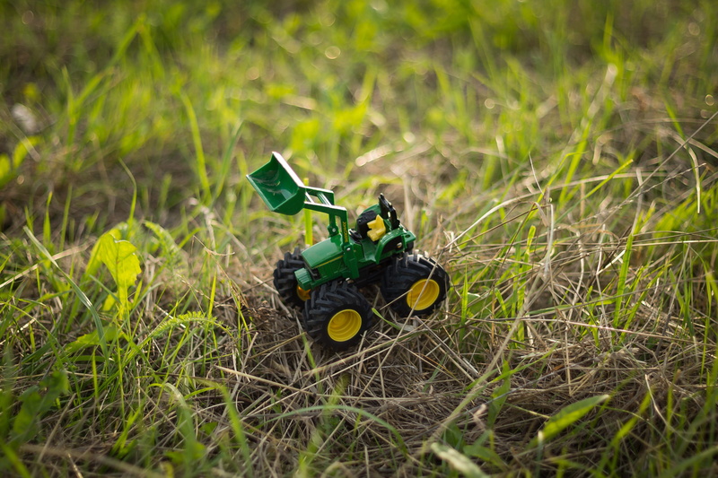 farm, growth, toy car, sunlight, green color, transportation, land, meadow, mode of transportation, harvest, outdoors, rural scene, grass, nature, tractors