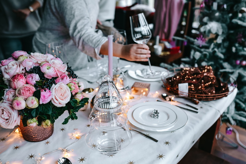 candle, plate, event, flower, people, flower arrangement, indoors, decorating, holding, food, sweet, hand, cutlery, sweet food, glass, restaurant, 5K