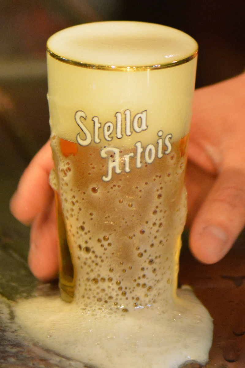 latte, refreshment, finger, human hand, close-up, coffee, tap, disposable cup, one person, food and drink, beer, indoors, focus on foreground, stella artois