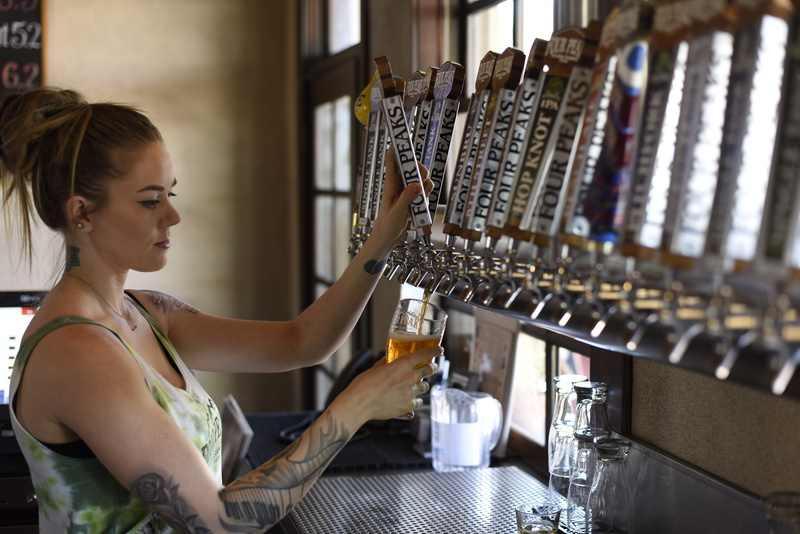 alcoholic beverage, stock, wear, holding, leisure activity, one person, brew, food and drink, hairstyle, beer, indoors, music, woman, selective focus, young adult